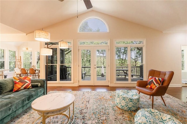 sunroom / solarium featuring french doors, vaulted ceiling, and ceiling fan