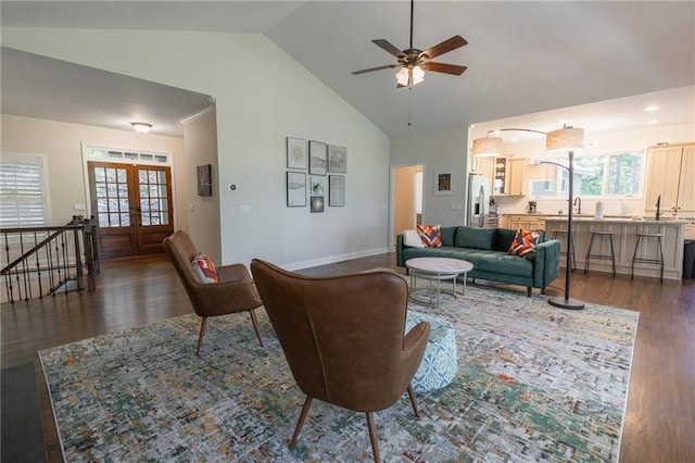 living room featuring ceiling fan, french doors, sink, high vaulted ceiling, and dark hardwood / wood-style floors