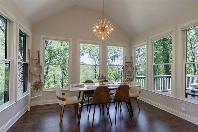 sunroom / solarium with vaulted ceiling and a notable chandelier