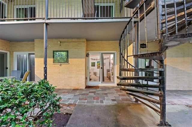 5400 Roswell Rd Apt L6, Sandy Springs, GA 30342 - doorway to property featuring brick siding and a balcony