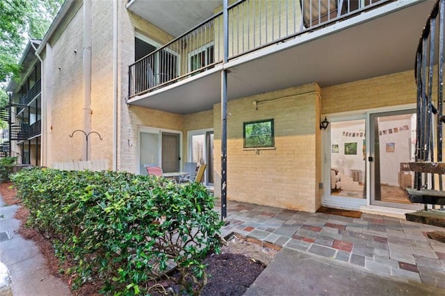 5400 Roswell Rd Apt L6, Sandy Springs, GA 30342 - property entrance with brick siding and a balcony