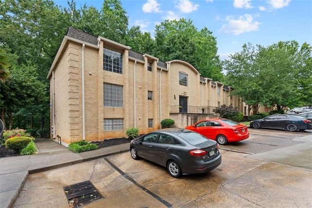 5400 Roswell Rd Apt L6, Sandy Springs, GA 30342 - view of building exterior featuring uncovered parking