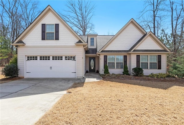 traditional-style home with concrete driveway and a shingled roof