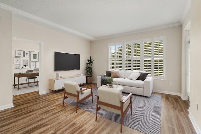 living room featuring wood-type flooring and ornamental molding