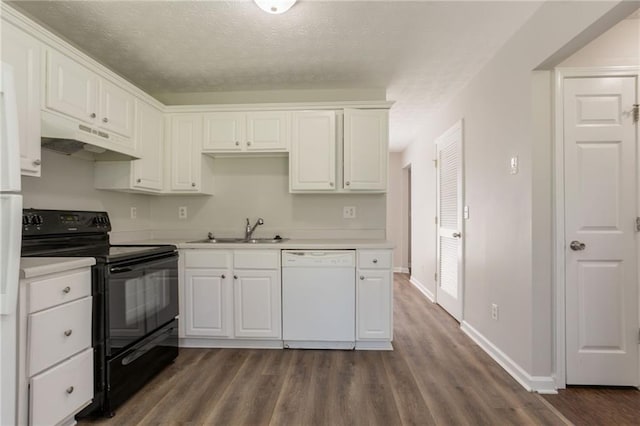 711 Ashley Ln, Stone Mountain, GA 30087 - kitchen featuring white dishwasher, black / electric stove, under cabinet range hood, dark wood finished floors, and a textured ceiling
