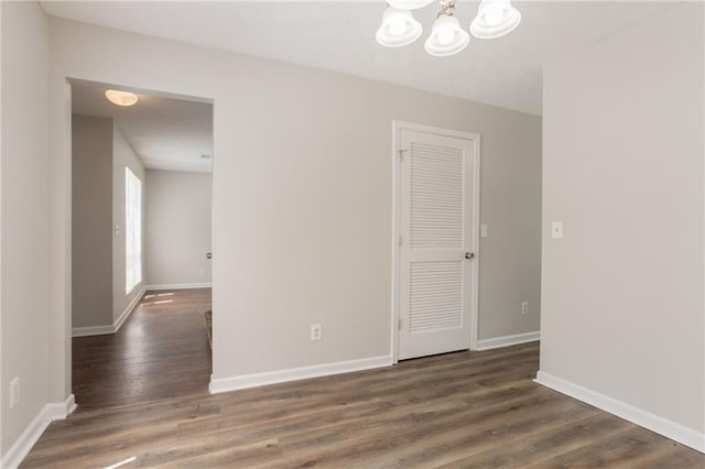 711 Ashley Ln, Stone Mountain, GA 30087 - empty room featuring a chandelier and wood finished floors