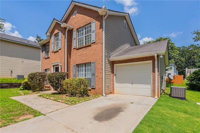 711 Ashley Ln, Stone Mountain, GA 30087 - view of front of house with a garage, driveway, a front lawn, and brick siding