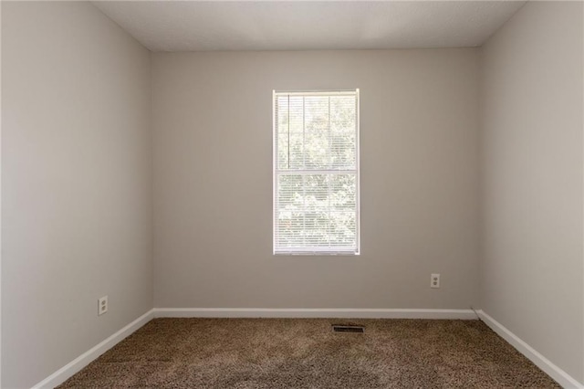 711 Ashley Ln, Stone Mountain, GA 30087 - carpeted spare room with baseboards