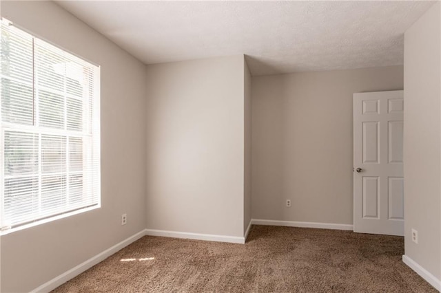 711 Ashley Ln, Stone Mountain, GA 30087 - spare room featuring healthy amount of natural light and carpet floors