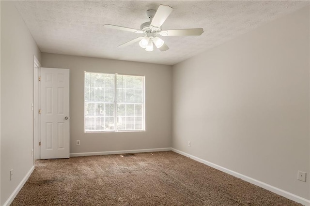 711 Ashley Ln, Stone Mountain, GA 30087 - carpeted spare room featuring a textured ceiling and a ceiling fan