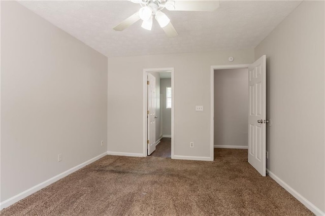 711 Ashley Ln, Stone Mountain, GA 30087 - unfurnished bedroom with carpet flooring, a ceiling fan, and a textured ceiling