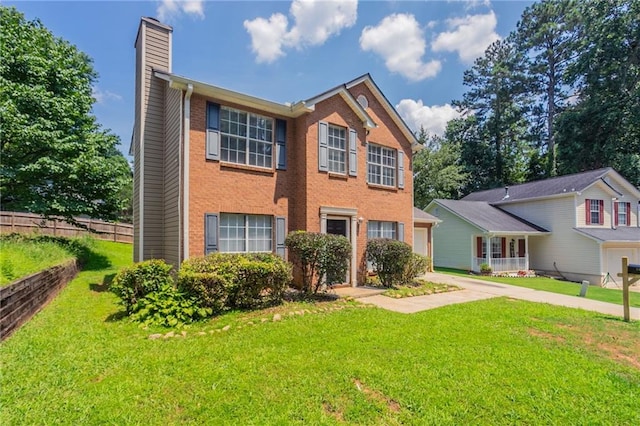 711 Ashley Ln, Stone Mountain, GA 30087 - view of front facade featuring a chimney, a garage, brick siding, and driveway