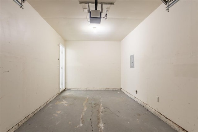 711 Ashley Ln, Stone Mountain, GA 30087 - garage with electric panel and a garage door opener