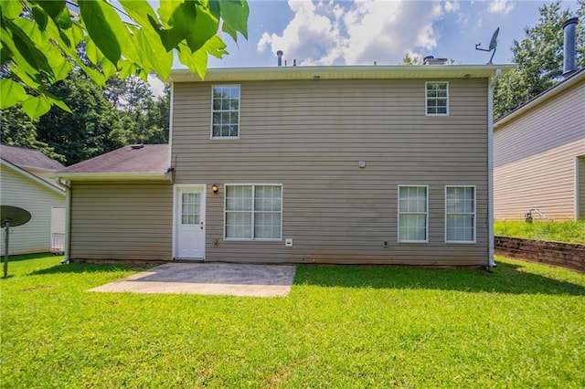711 Ashley Ln, Stone Mountain, GA 30087 - back of property featuring a patio and a yard