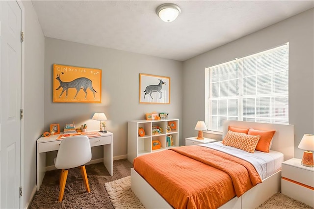 711 Ashley Ln, Stone Mountain, GA 30087 - carpeted bedroom with baseboards and a desk
