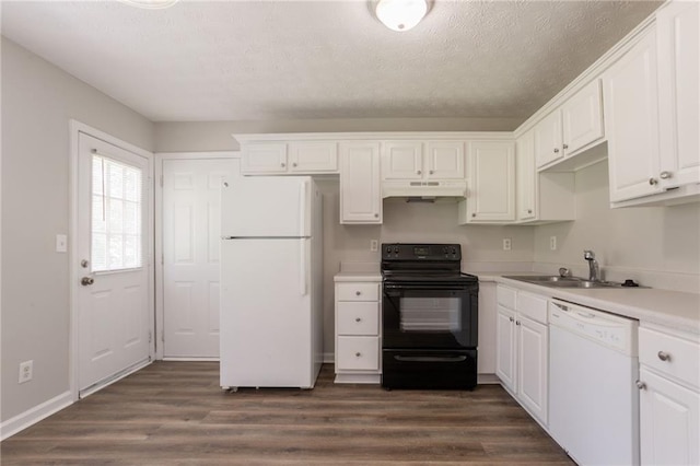 711 Ashley Ln, Stone Mountain, GA 30087 - kitchen featuring white appliances, under cabinet range hood, a textured ceiling, and white cabinetry