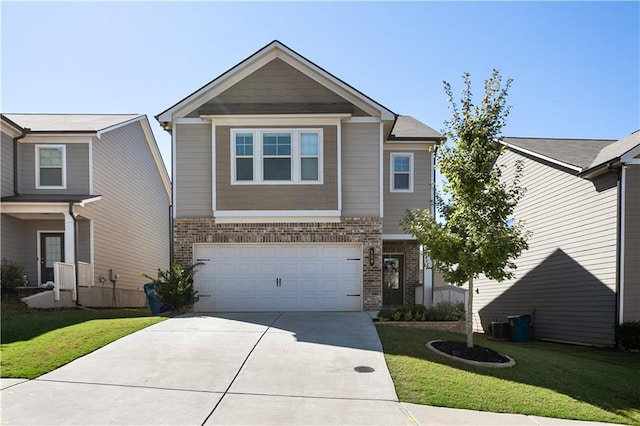 view of front of home with a garage and a front lawn