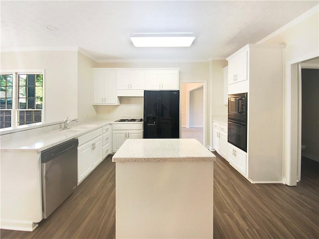 kitchen with sink, dark wood-type flooring, kitchen peninsula, white cabinets, and black appliances