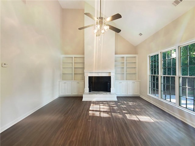 unfurnished living room with high vaulted ceiling, ceiling fan, and dark wood-type flooring