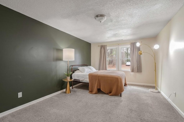 carpeted bedroom featuring a textured ceiling