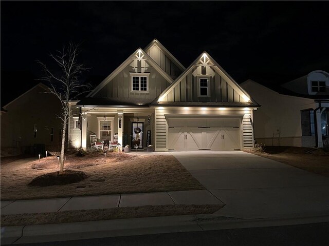 craftsman-style house with covered porch and a garage