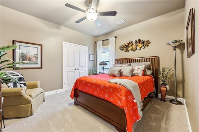 bedroom featuring ceiling fan, carpet flooring, and a closet