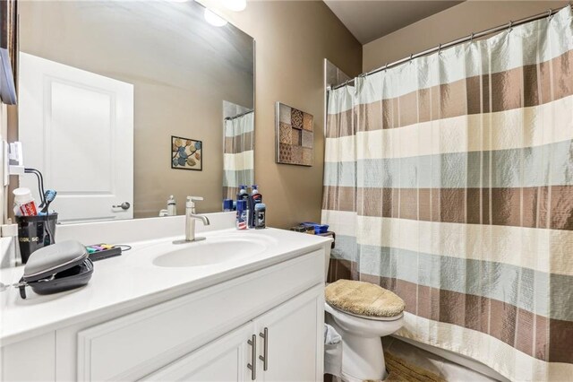 bathroom with toilet and vanity