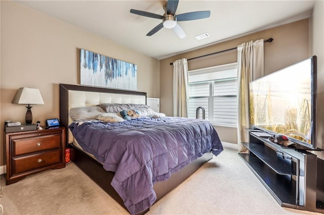 bedroom with light carpet and ceiling fan