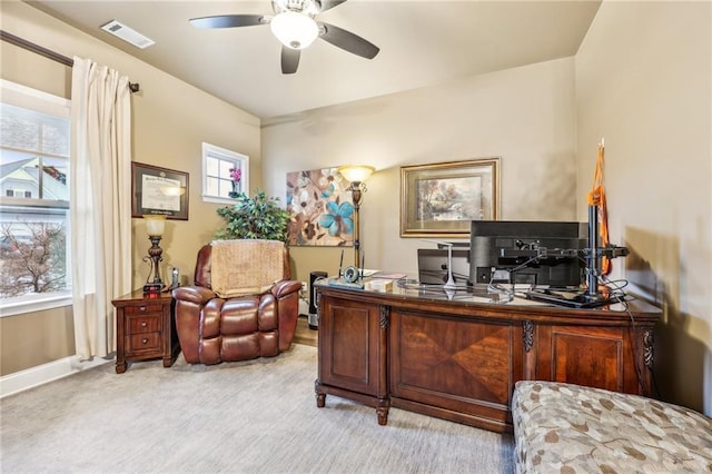 home office with ceiling fan and light colored carpet