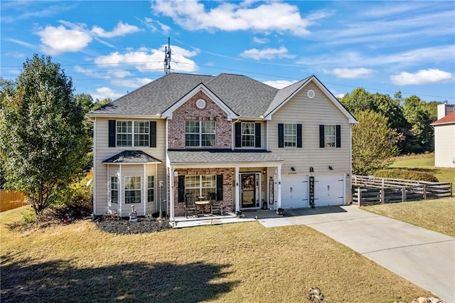 view of front of house featuring a garage and a front lawn