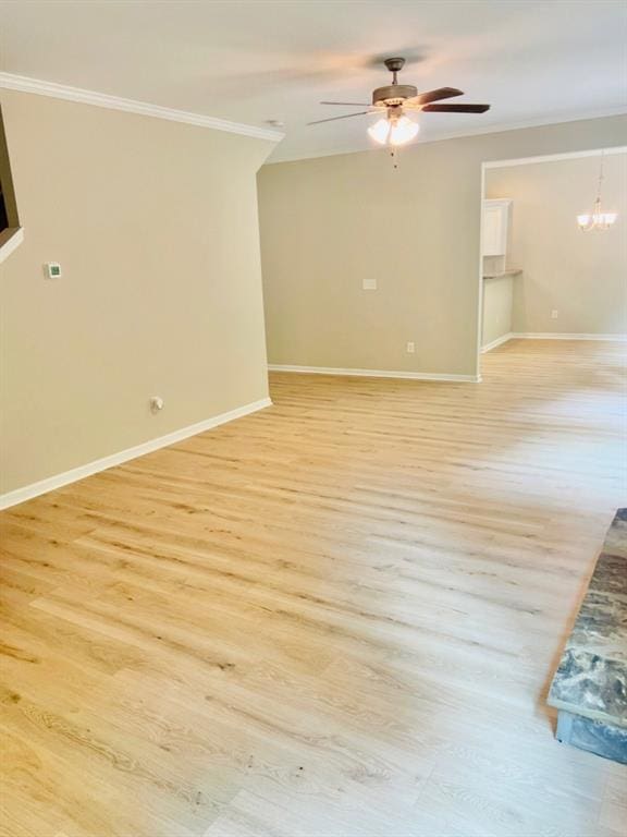 377 Fieldcrest Dr, Dallas, GA 30132 - unfurnished room with crown molding, a ceiling fan, light wood-style flooring, and baseboards
