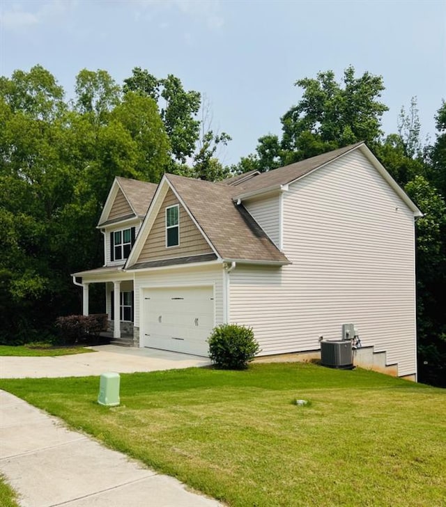 377 Fieldcrest Dr, Dallas, GA 30132 - view of side of home featuring driveway, a yard, and cooling unit