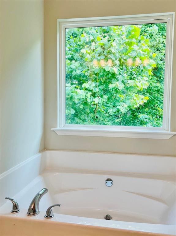 377 Fieldcrest Dr, Dallas, GA 30132 - bathroom featuring plenty of natural light and a garden tub