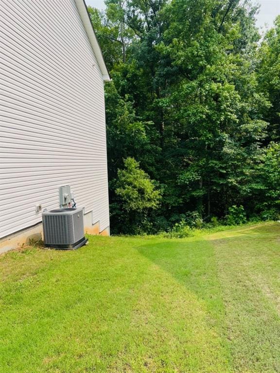 377 Fieldcrest Dr, Dallas, GA 30132 - view of green lawn featuring central AC