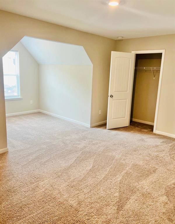 377 Fieldcrest Dr, Dallas, GA 30132 - unfurnished bedroom featuring carpet flooring, baseboards, a closet, and lofted ceiling