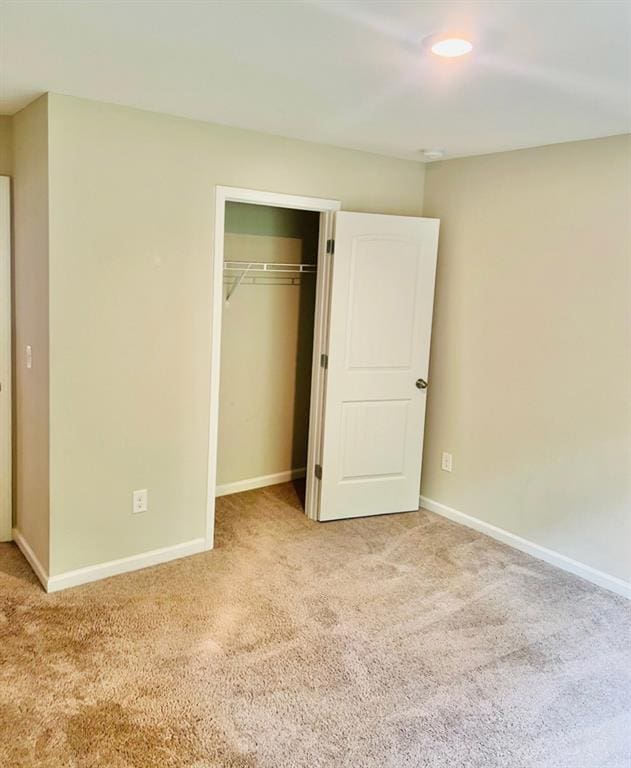 377 Fieldcrest Dr, Dallas, GA 30132 - unfurnished bedroom featuring carpet flooring, baseboards, and a closet