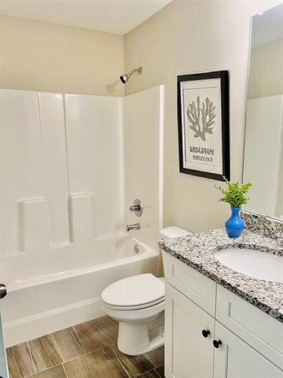 377 Fieldcrest Dr, Dallas, GA 30132 - full bath with vanity, toilet, bathing tub / shower combination, and wood finished floors