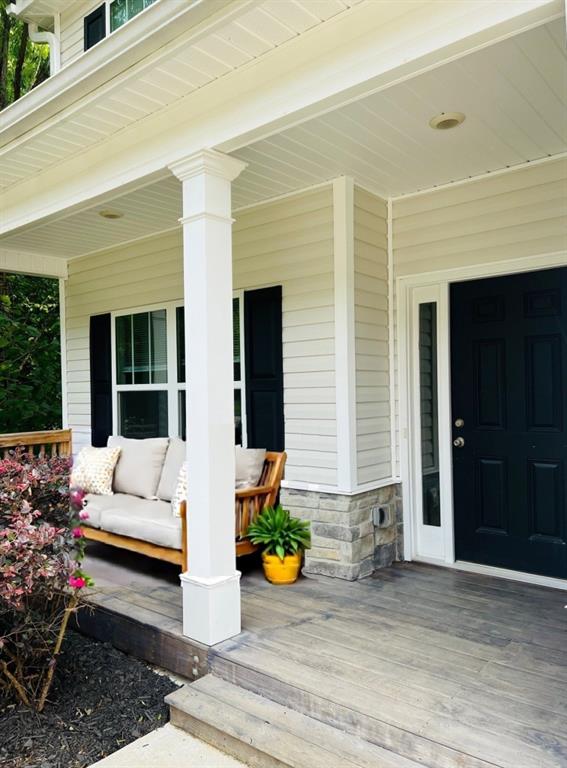 377 Fieldcrest Dr, Dallas, GA 30132 - view of exterior entry with a porch and stone siding