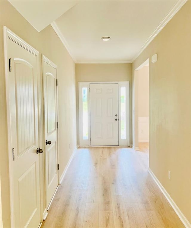 377 Fieldcrest Dr, Dallas, GA 30132 - foyer with light wood finished floors, crown molding, and baseboards