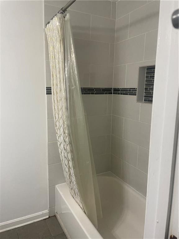 23210 Plantation Dr NE, Atlanta, GA 30324 - bathroom with baseboards, tile patterned flooring, and shower / tub combo with curtain