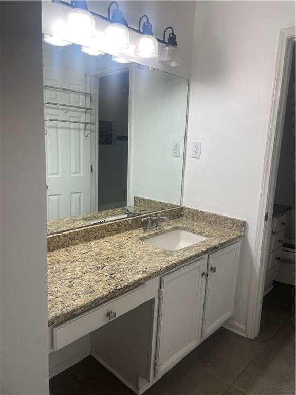 23210 Plantation Dr NE, Atlanta, GA 30324 - bathroom with tile patterned floors and vanity