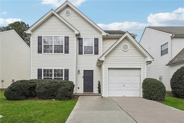 traditional home featuring a front yard, concrete driveway, and an attached garage