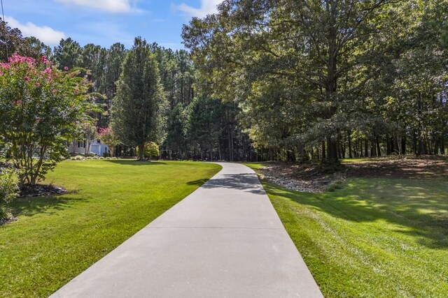 surrounding community with a lawn