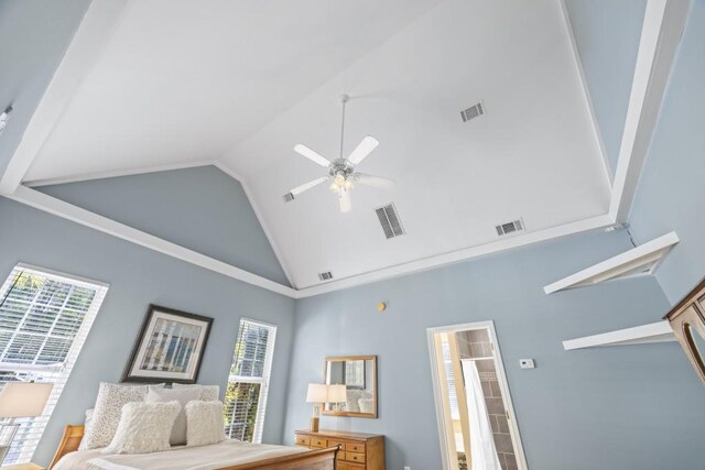 bedroom with visible vents and multiple windows