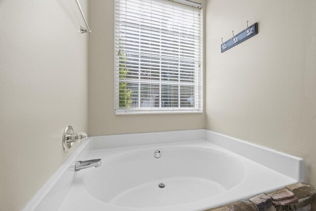 full bathroom featuring a garden tub