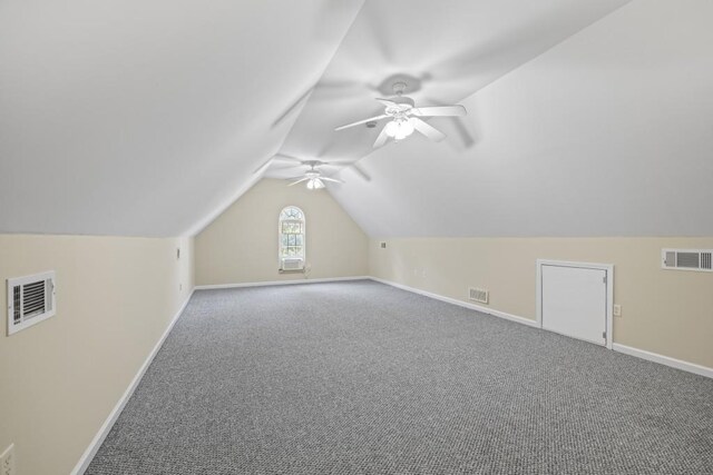additional living space with carpet, ceiling fan, and visible vents