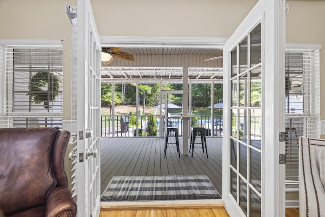 interior space with hardwood / wood-style floors and ceiling fan