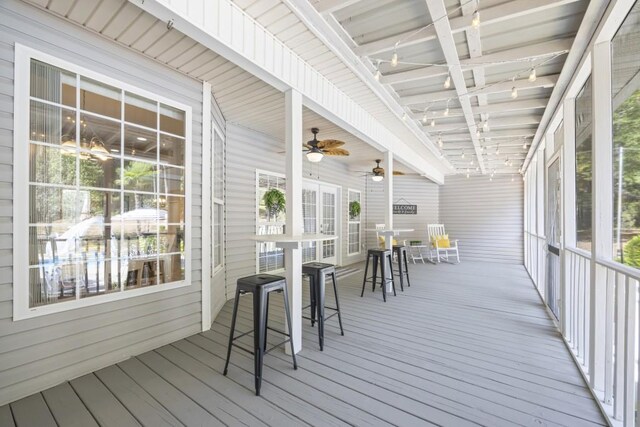 exterior space featuring ceiling fan