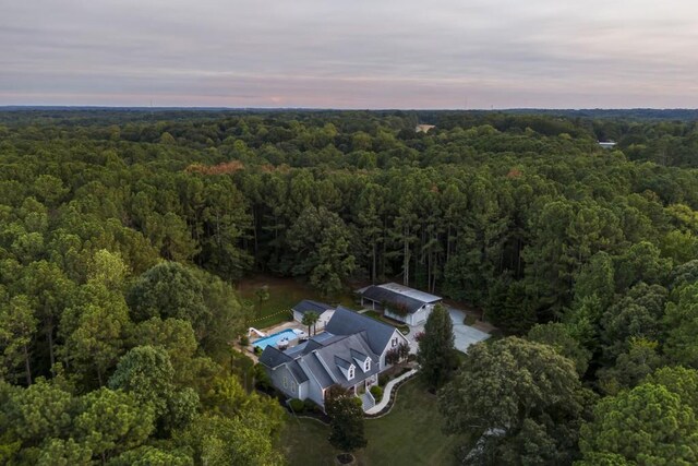 bird's eye view featuring a forest view