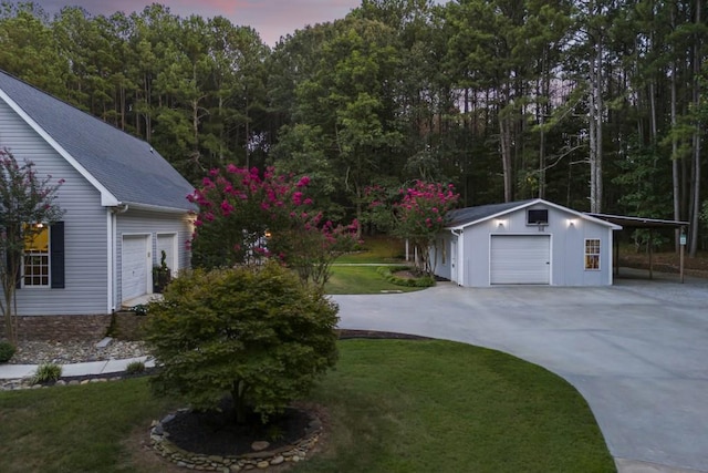 exterior space featuring an outbuilding and a garage